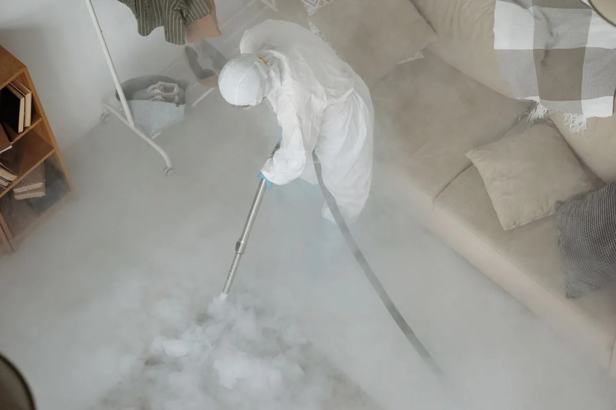 Biohazard cleanup technician in protective equipment, Stonewood, WV